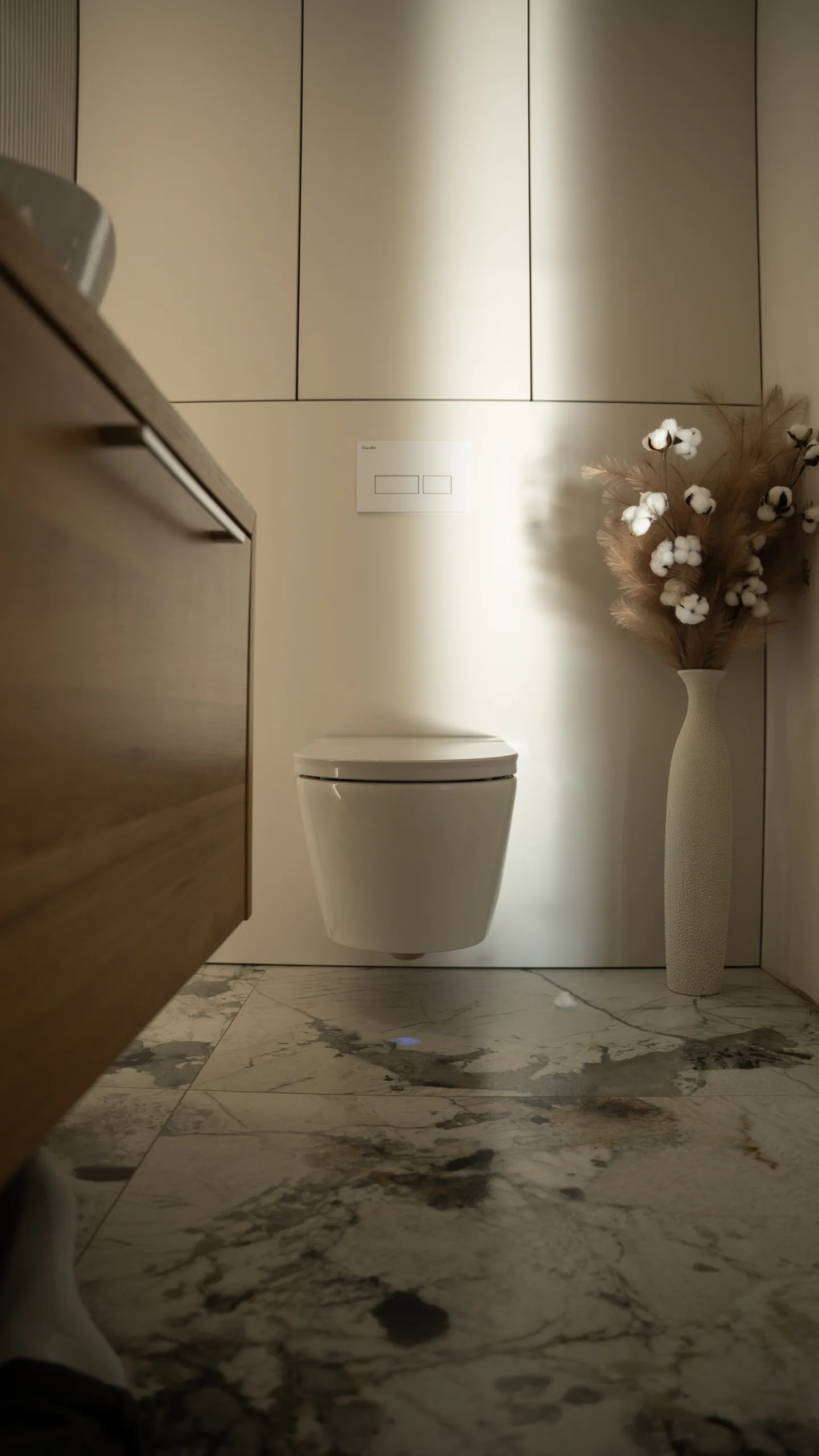 CleanWave Breeze in a warm, softly lit bathroom with stone-pattern flooring